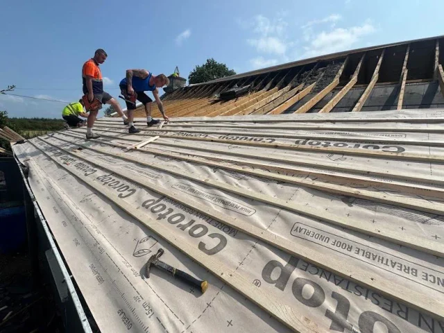 New permeable roofing membrance being installed during a roof repair in Cork
